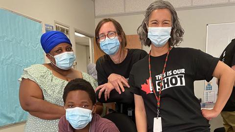 A group photo at the newcomer immunization clinic