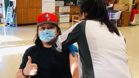 Image of man being vaccinated against COVID-19.