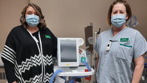 Staff standing near equipment.