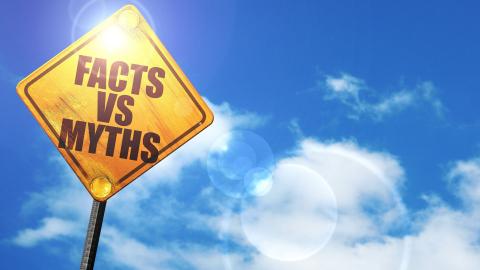 Stylized road sign that reads, “Facts vs Myths”