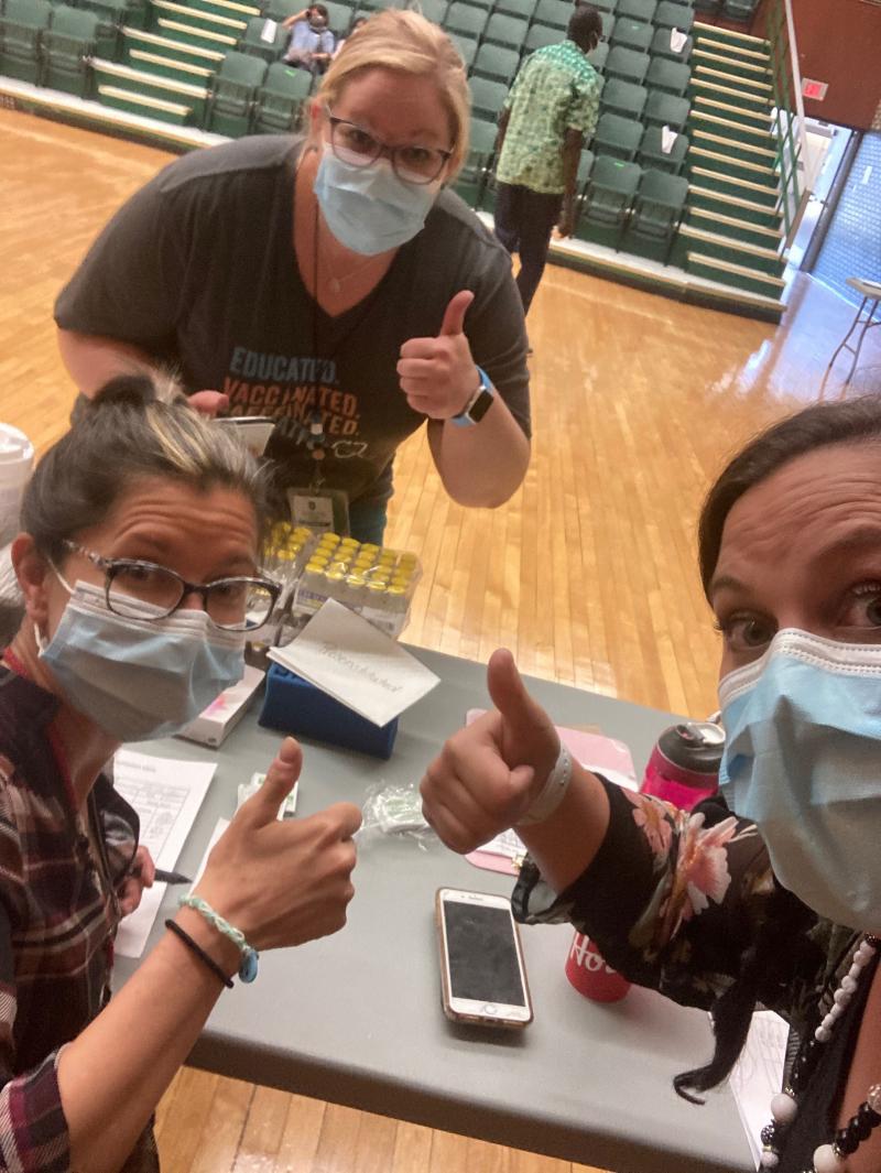Vaccinators at a school clinic