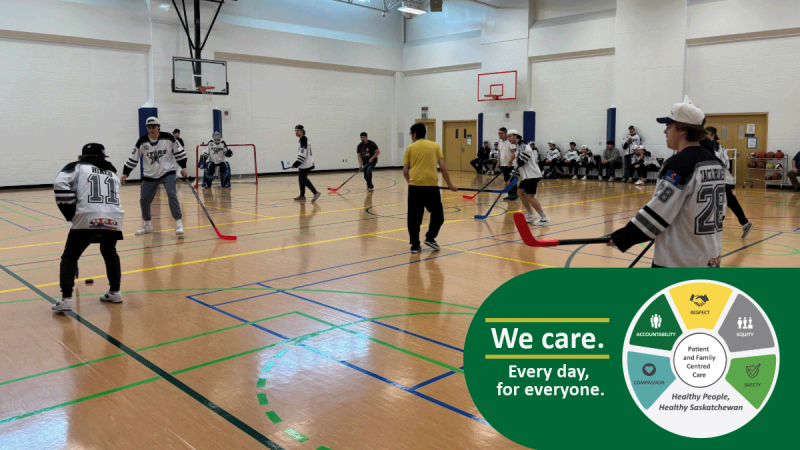 Battlefords North Stars hockey team playing floor hockey with patients
